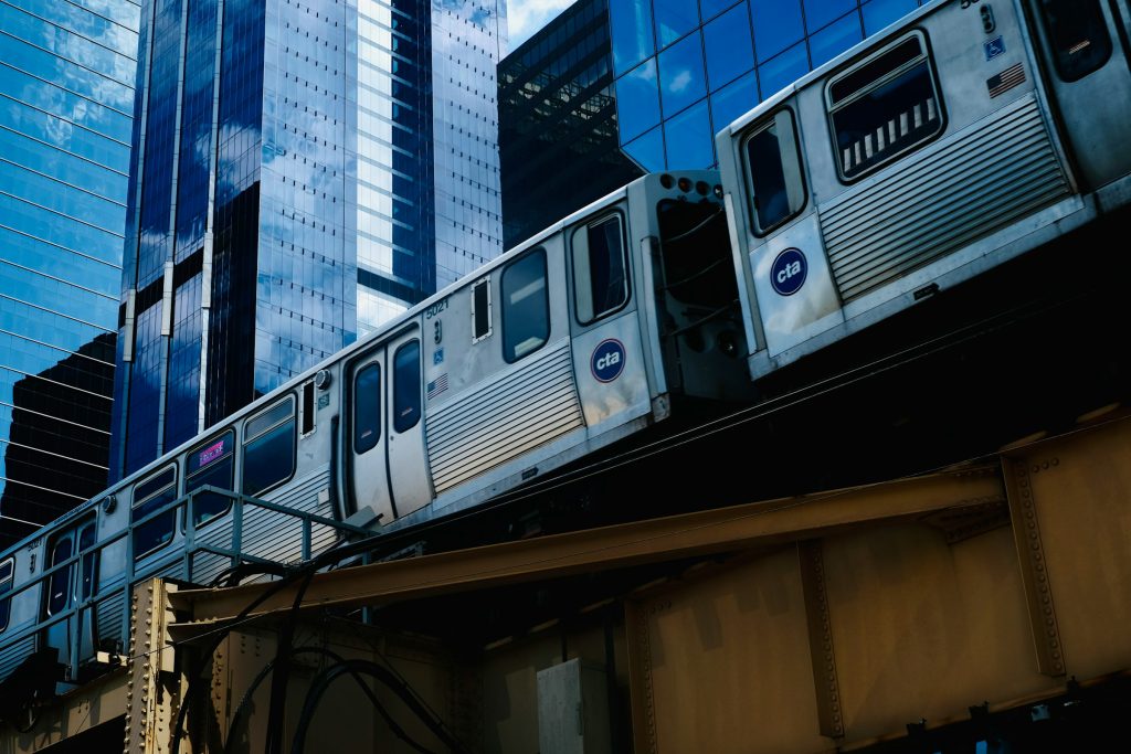 Chicago CTA elevated train passing downtown skyscrapers