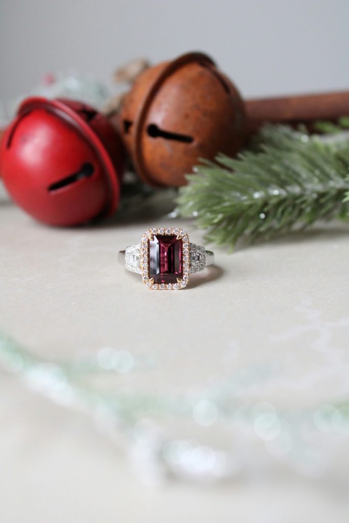 Czech garnet ring with a deep red gemstone and diamond halo