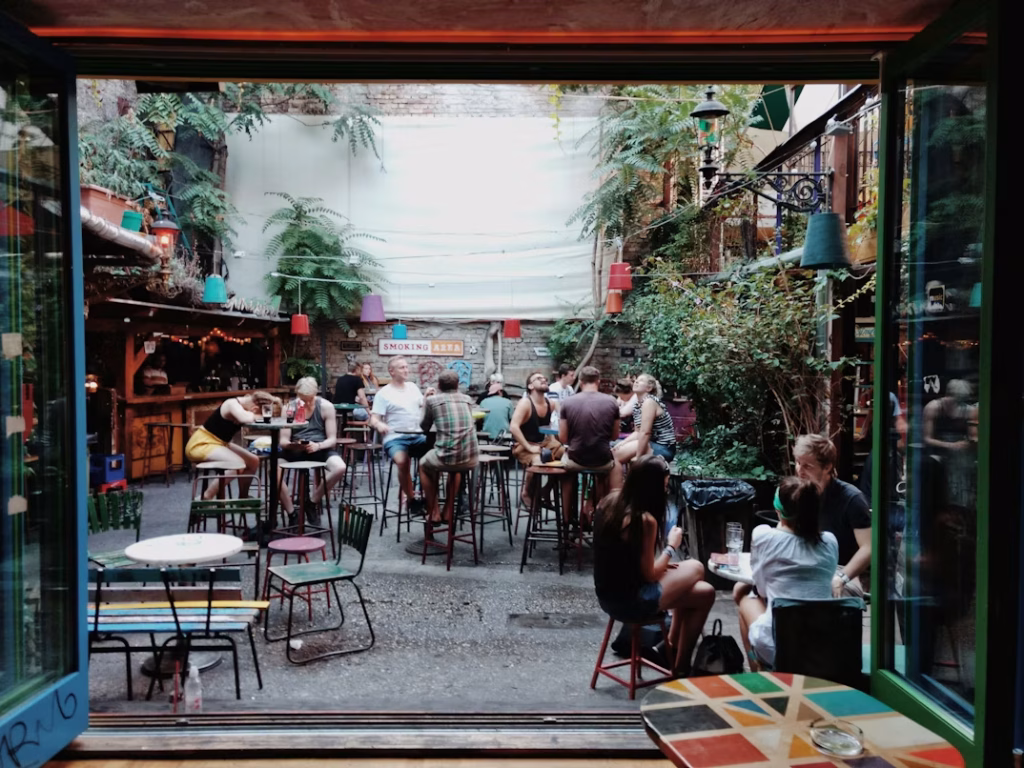 Budapest ruin bar courtyard with people dining