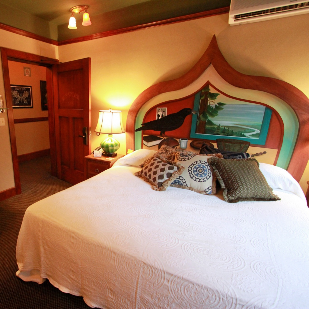 McMenamins room with mural headboard